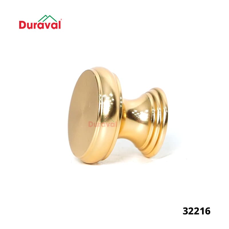 Núm tay nắm tủ Duraval mã 32216 dáng tròn màu vàng đồng trên nền trắng