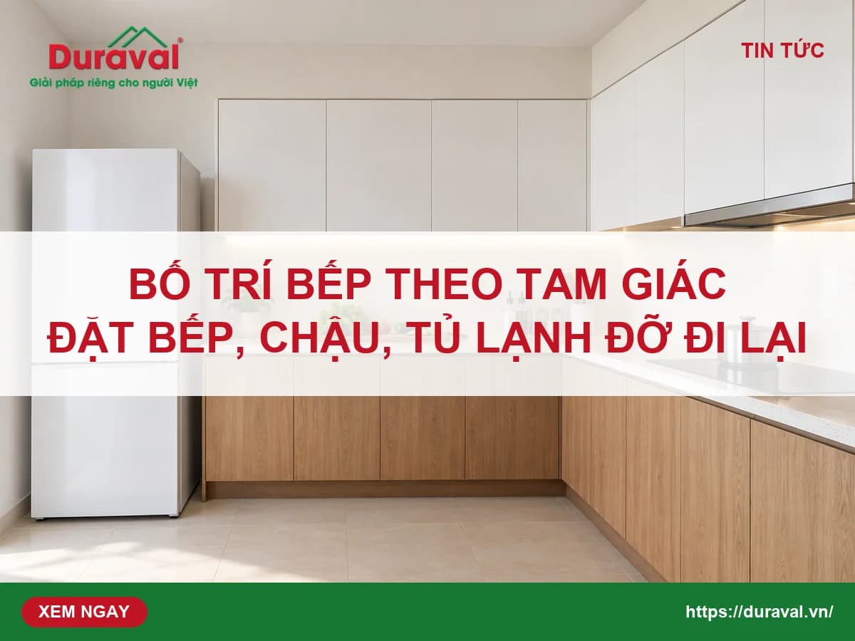 Bếp chữ L có tủ lạnh, bếp từ và mặt đá sơ chế trong căn hộ